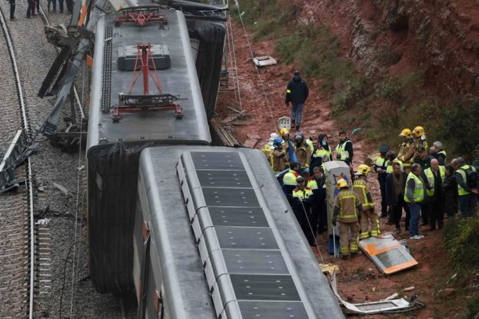 1 killed, at least 76 injured in Catalonia two-train head-on collision